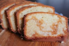 slices of bread sitting on top of a wooden cutting board