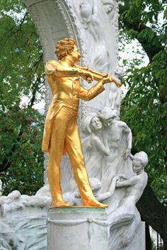 a statue of a man playing the violin