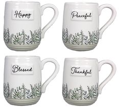 four white coffee mugs with the words happy, peaceful and thank written on them