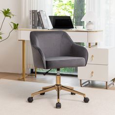 an office chair sitting in front of a desk with a laptop on top of it