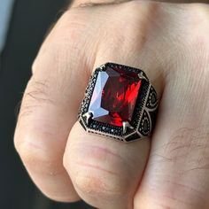 Introducing our exquisite Ruby Silver Men's Ring, featuring a captivating red Garnet stone. Handcrafted with love, this unique piece showcases a stunning Ottoman style design that effortlessly combines tradition and modernity. Made with high-quality 925k sterling silver, this ring exudes a luxurious feel and guarantees exceptional durability. This remarkable masterwork is the perfect gift for that special man in your life, making it an ideal choice for birthdays, anniversaries, or any special oc Luxury Red Gemstones With Accent Stones, Red Polished Lab-created Ruby Jewelry, Red Lab-created Ruby Jewelry With Polished Finish, Red Polished Finish Signet Ring As Gift, Red Jewelry With Polished Finish For Gift, Red Jewelry With Accent Stones For Gift, Red Ruby Ring With Polished Finish Gift, Gift Ruby Ring With Hallmark, Polished Lab-created Ruby Ring