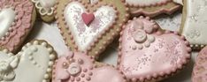 some heart shaped cookies are on a table