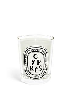 a candle that is sitting in front of a white background with the words y p r s on it