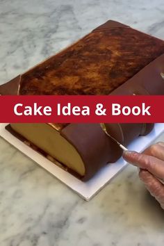 a person cutting into a cake on top of a table with the words cake idea and book