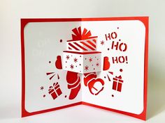 a red and white christmas card with presents on it