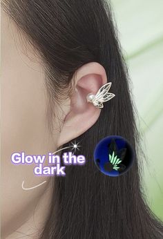 an ear piercing is shown with the glow in the dark butterfly on it's side