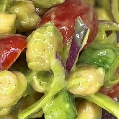 a pile of green and red peppers sitting on top of each other