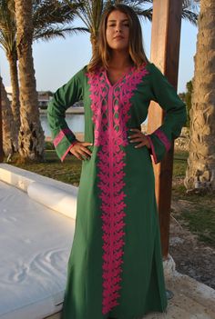 A stunning embroidered Kaftan dress that is elegant, colorful, and unique! The dress is made of Egyptian cotton that has a soft feel to it so you will surely feel comfortable and royal in it. It also comes with a small invisible pocket on the right side of the Kaftan for added practicality. You can wear this Kaftan practically anywhere and for any occasion. You can dress it up with a pair of heels and strut like an Egyptian queen in any gathering, resort, or party. Or you can dress it down with Traditional Green V-neck Tunic, Traditional Green V-neck Dress, Green Kaftan With Resham Embroidery For Festivals, Green Kurta With Embroidered Neckline For Eid, Green V-neck Dresses For Festivals, Traditional Green Maxi Length Kaftan, Green Traditional V-neck Dress, Traditional Green Kurta With Embroidered Neckline, Traditional Green Long Sleeve Maxi Dress