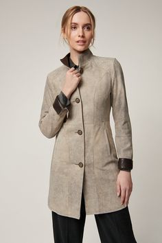 With a sophisticated texture and a graceful ¾-length silhouette, the Gwyneth swing coat takes you from country roads to city streets in style. It's crafted from English suede lambskin that's been carefully distressed for a rich, rugged finish in both color and texture. The lambskin-leather-lined standup collar and roll-back cuffs make Gwyneth a perfect option to wear casually with jeans or dressed up with cashmere sweaters and skirts. Sweaters And Skirts, Distressed Leather, City Streets, Lambskin Leather, Leather Coat, Cashmere Sweaters, Country Roads, Cashmere, Dress Up