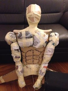 a paper mache sitting on top of a wooden floor