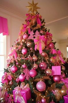 a decorated christmas tree with pink and gold ornaments