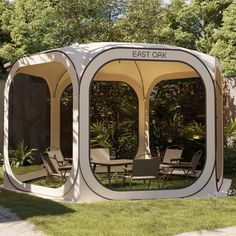 an outdoor area with chairs, tables and a gazebo in the middle of it