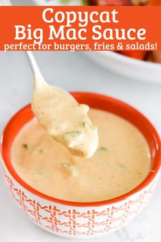 a spoon full of soup with the words copycat big mac sauce perfect for burgers, fries and salads