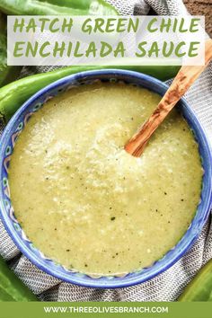 green chili enchilada sauce in a blue and white bowl with a wooden spoon