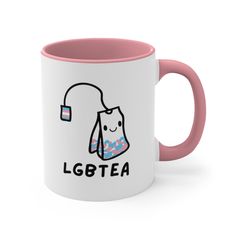 a pink and white coffee mug with the words lgttea on it