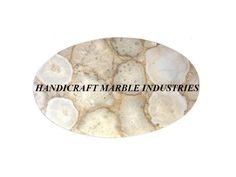 an oval sticker with the words handcraft marble industries on it