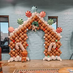 an arch made out of balloons and candy canes