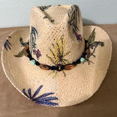 Floral Print Cowboy/Sun Hat with a Beaded Hat Band with a Multiple Strand Bow with Beaded Accents This is a very fun hat to have in your wardrobe.  It will go with jeans/dress and boots for a fun day or for a night on the town. Hat size: One size fits all Dress And Boots, Fun Hat, Chapeau Cowboy, Beaded Hat, Cow Boy, Cool Hats, Hat Band, Sun Hat, Hat Sizes