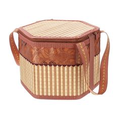 a brown and white basket with straps on it