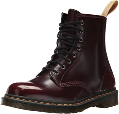 PRICES MAY VARY. 100% vegan, signified by the special yellow heel-loop Made with Cherry Red Cambridge brush-off, a soft, subtle two-tone synthetic material Retains all the classic doc's DNA Built on the iconic Dr. Martens air-cushioned sole A tough and durable Goodyear welted construction Cherry Doc Martens, Cherry Red Docs, Red Docs, Red Doc Martens, Current Aesthetic, Xmas Wishlist, Dr Martens Womens, Yellow Heels, Vegan Boots