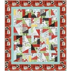 a quilt with red, green and white designs on it's border is shown