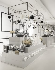 a white room filled with lots of black and white decorations