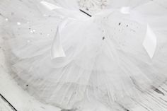 Thanks for visiting Daisy Belle Rose! Super cute white tutu with silver stars - made with three full layers of fluffy tulle. Elasticated crochet band waist with a ribbon threaded through for extra tightening. Please visit my shop for more beautiful tutus x