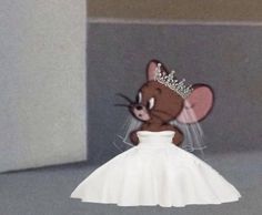 a mouse in a wedding dress with a tiara