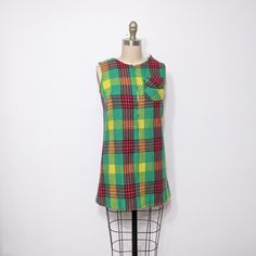 Vintage 1960's Tartan Plaid Jumper Mini Dress. Zipper Down The Front With A Small Pocket Front. Straight Cut, Mini Shape. Retro British Beatles Style Dress. Imagine This With A Pair Of Leggings And Some Leather Boots! Some Damage On The Shoulder Seam, Could Easily Be Fixed - - M E A S U R E M E N T S - - Fits Like: Small Bust: 17" Flat Waist: 16.5" Length: 29" Fabric: Acrylic Wool Blend Beatles Style, Beatles Fashion, Plaid Jumper, Costume Inspo, Hair Flip, Dress Zipper, Plaid Dress, Tartan Plaid, Small Bust