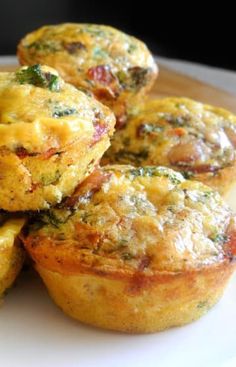 several small muffins on a white plate