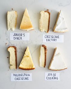 different types of cheesecakes arranged in a circle on a white counter top with labels