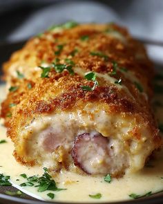 a close up of a plate of food with meat and gravy on it