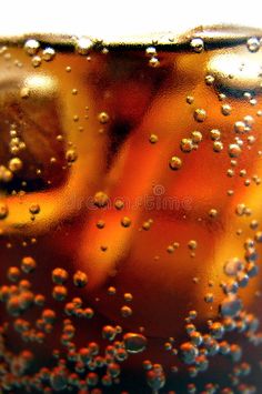 an orange soda in a glass with water droplets on the surface royalty images and clippings