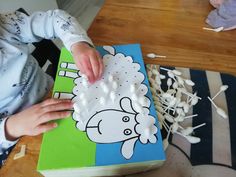 a young child is playing with an animal puzzle