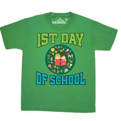 a green tshirt with the words 1st day of school on it and an image of