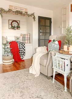 a living room filled with furniture and christmas decorations