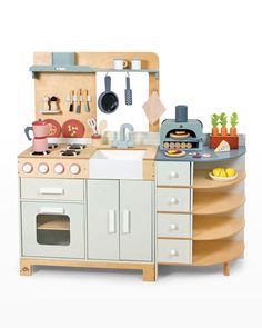 a toy kitchen with an oven, stove and sink