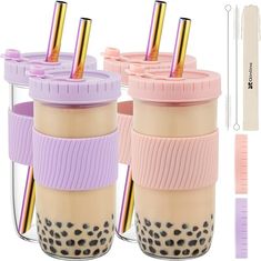 three coffee cups with straws in them