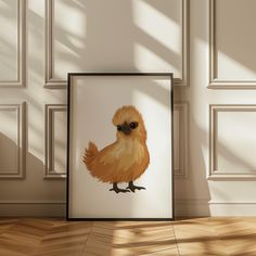 a framed photograph of a chicken on a wall