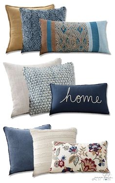 four pillows with the words home on them and one pillow that is blue, brown, white