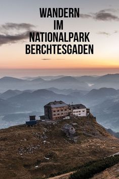 an old building sitting on top of a hill with the words wandern im nationalpark berchesgaden