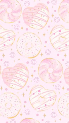 a pink and gold donut pattern on a white background with stars in the sky