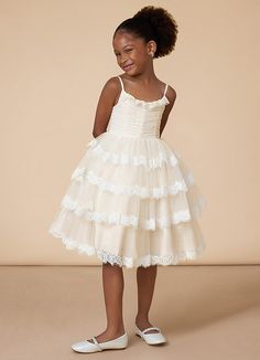 Cloie is our adorable flower girl dress cut from tulle. She features a scoop neckline embellished with ruffles and spaghetti straps. The look is complete with a tiered A-line skirt. Kids Reference, Classic Flower Girl Dress, Petal Flower Girl Dress, Whimsy Flowers, Flower Girl Dresses Champagne, Bridal Party Outfit, White Champagne, Eclectic Wedding, Tulle Flower Girl