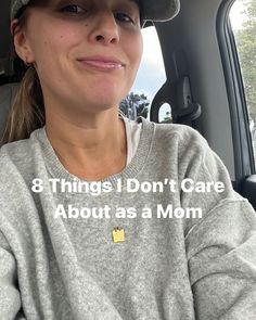 a woman in a car with the words 8 things i don't care about as a mom