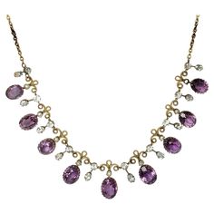 The amethyst stone are a gorgeous purple colour which sit beautifully in gold claw settings. The stones slightly graduate in size from the centre of the necklace to the fastening. In-between the stones is detailed gold work and there are drops set with aquamarine. This comes in its original box. Length: 40cm Stone Dimensions: 11x9-9x7mm Weight: 15.8g Formal Purple Gemstone Necklace, Classic Amethyst Purple Necklace, Purple Prong Setting Formal Necklaces, Purple Necklace With Prong Setting For Anniversary, Classic Purple Amethyst Necklace, Purple Prong Set Necklace For Anniversary, Elegant Purple Necklace With Prong Setting, Classic Purple Necklace For Anniversary, Formal Purple Amethyst Necklace