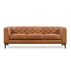 a brown leather couch with wooden legs and buttons on the armrests, against a white background