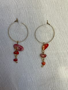 These earrings are handmade with salvaged red choral beads and gold-toned wire and hoops. The are very elegant and unique at the same time.  Earring length: 2 inches Instagram: @bead.brain for more jewelry info and inspo! request trades, custom jewelry or alterations Wire Jewelry With Beads, Red Wire Wrapped Dangle Earrings, Handmade Red Small Hoop Earrings, Nickel Free Red Hoop Earrings, Nickel-free Red Hoop Earrings, Red Metal Dangle Beaded Earrings, Red Small Hoop Nickel-free Earrings, Red Dangle Beaded Metal Earrings, Red Dangle Beaded Earrings