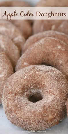 a pile of apple cider doughnuts sitting on top of a table