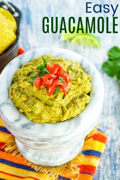 guacamole in a white bowl on top of a colorful towel with text overlay