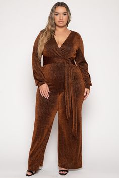 This plus size, stretch jumpsuit features a v-neckline, shoulder pads,  long sleeves, self tie sash and a flare leg  and  a metallic ribbed detail fabric Content + Care 64% Nylon 30%Lurex & 6% Spandex Hand wash cold   Model Measurement Wearing a Size 2X Height: 5' 10" Bust: 44" Waist: 40" Hip: 56" Stretch Jumpsuit, Floral Dress Formal, Kimono Sweater, Bodycon Dresses Casual, Faux Leather Dress, Sparkle Dress, Jumpsuit Party, Leather Dresses, Maxi Dress Party